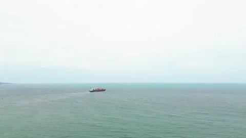 Aerial view of a cargo ship sailing in the ocean near Itajaí, Brazil Video stock 329078112