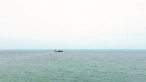 Aerial view of a cargo ship sailing in the ocean off Itajaí, Brazil. Video stock 329078123