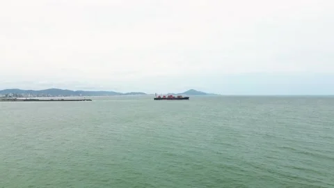 Aerial view of a cargo ship sailing in the ocean near Itajaí, Brazil Stock Footage 329078139