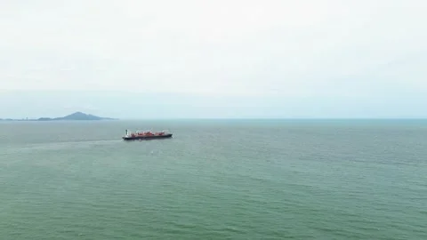 Aerial view of a cargo ship sailing in the ocean near Itajaí, Brazil Video stock 329078140