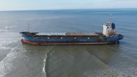 Aerial view of a cargo ship stranded off the coast of the city of Al-Jubail Stock Footage 111219909