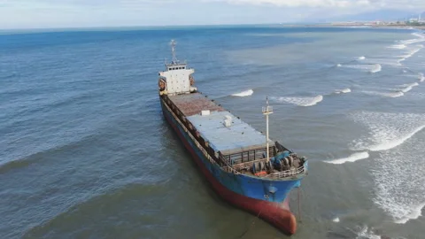 Aerial view of a cargo ship stranded off the coast of the city of Al-Jubail Stock Footage 111220259