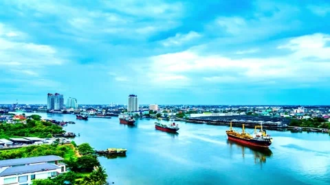 Aerial View of Cargo Ships Navigating a River in a City Stock Footage 310379986