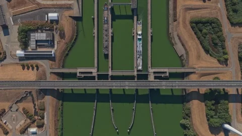 Aerial view of cargo ships passing through krammersluizen locks Stock Footage 342812977