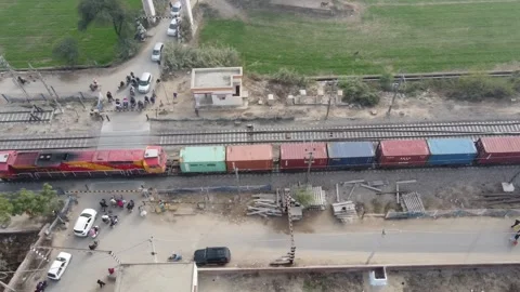 Aerial view of a cargo train moving along rural tracks Stock-Footage 335270948