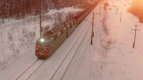 Aerial view of cargo train at winter time. Delivery concept. Stock Footage 250437412