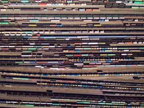 Aerial view of cargo trains. Railway wagons with goods on railroad. Stock Photos