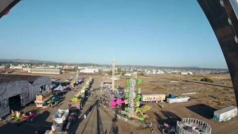 An aerial view of carnival grounds from Ferris wheel Stock Footage 341445794
