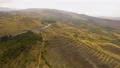 Aerial view of cars driving along empty road on hills in Armenia, recreation 4k or 4k+ Resolution