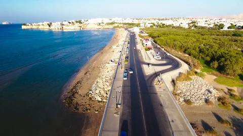 Aerial View of cars driving in Qurum beach road in Muscat, Oman Stock Footage
