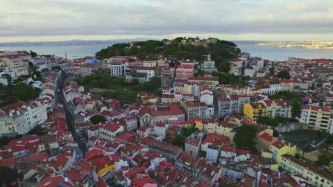 Aerial View of Castelo de S. Jorge, Lisboa, Portugal in 4K during sunset. Stock Footage 163318480
