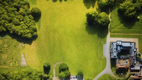 Aerial view of the castle surrounded by meadows and forests Stock Footage 142704039