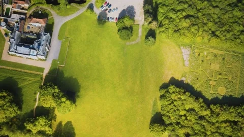 Aerial view of the castle surrounded by meadows and forests Vídeo Stock 144628007