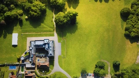 Aerial view of the castle surrounded by meadows and forests Vídeo Stock 147321315