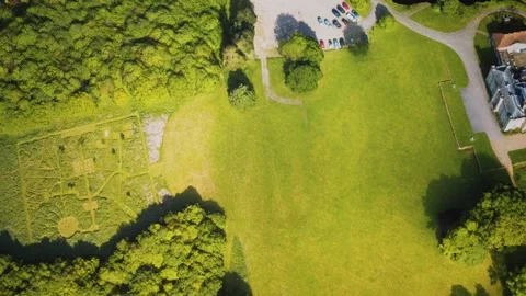 Aerial view of the castle surrounded by meadows and forests Vídeo Stock 157358531