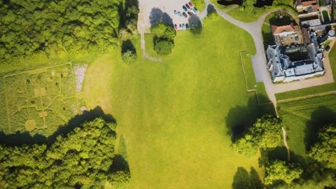 Aerial view of the castle surrounded by meadows and forests Vidéo 158374288