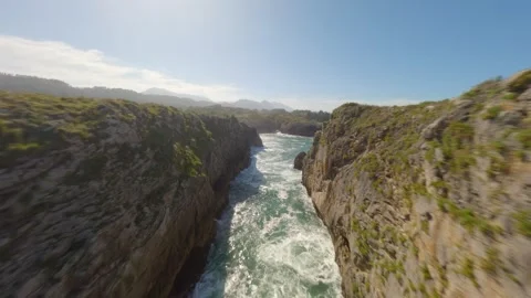 Aerial View Of Castro De Las Gaviotas Rock Arch In Asturias Spain Stock Footage 347054699
