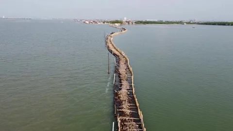 Aerial view of a causeway under construction over water Stock-Footage 279146087