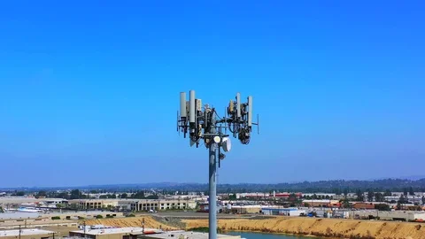 Aerial view of cell tower antennas for wireless phone networks Stock Footage 111051787