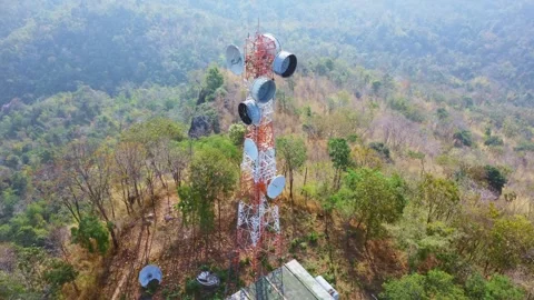 Aerial view of cellular antenna or communications tower on beautiful mountain Stock Footage 301199810