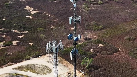Aerial View of a Cellular Communications Tower Stock Footage 295676273