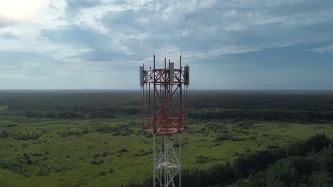 Aerial view to cellular tower with 5g internet antenna and 4g satellite dish Видео 137760972