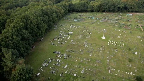 Aerial view of cemetary surrounded by trees Stock Footage 118263515