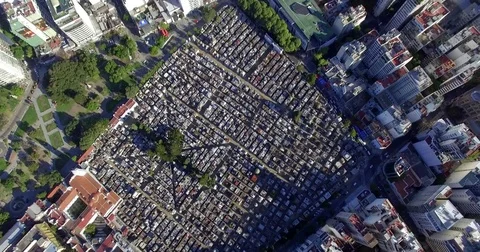 Aerial view of the Cemetry de la Recoleta tilting up to see the city of Buenos Stock Footage 77744103