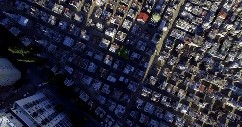 Aerial view of Cemetry de la Recoleta tilting up to reveal the city of Buenos 스톡 동영상 77744180
