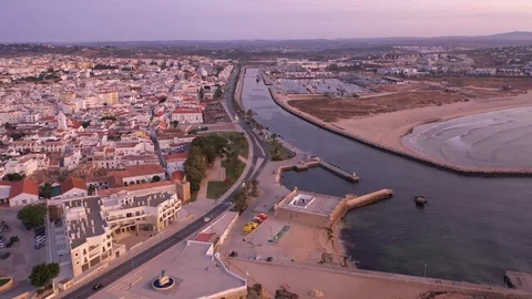 Aerial view of central part, beach of Lagos, Algarve, Portugal at early morning Stock Footage 115337119