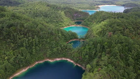 Aerial view of chain of turquoise lakes in lush green mountains of Chiapas Stock Footage 342906154