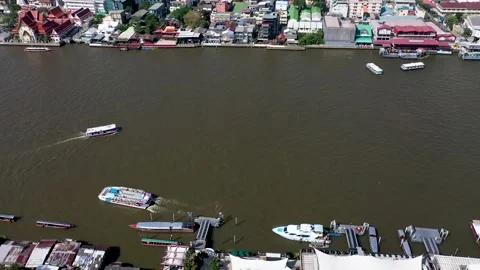 Aerial View Of Chao Phraya River with few boats sailing Stock Footage 230234101