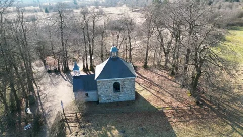 Aerial view of Chapel with bare trees, Belgium. Stock Footage 314101353