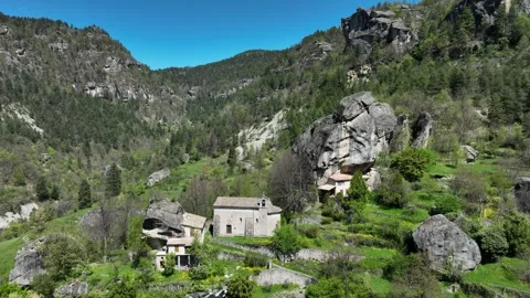 Aerial view, Chapel &amp; Boulder, Annot, Alps. Counterclockwise. Stock Footage 308283013