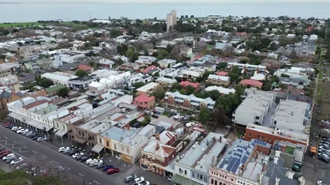 Aerial view of a charming seaside town with historical buildings and modern 스톡 동영상 337811682