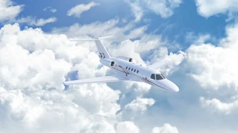 Aerial view of charter private jet flying above the clouds front view Stock Footage