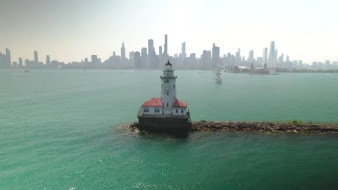Aerial view of the Chicago harbor lighthouse in Lake Michigan. Stock Footage 277372908