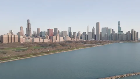 Aerial view of the Chicago Loop and Millennium Park on a spring morning Stock Footage 306122197
