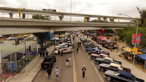 Aerial View of Chicano Park Day Car Show and Coronado Bridge Traffic San Diego Vídeo Stock 333490730