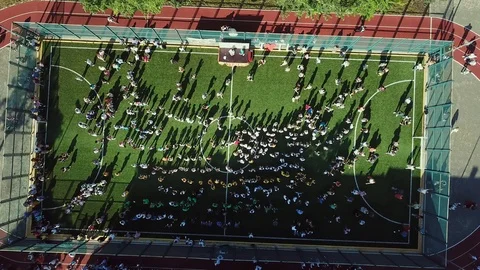 Aerial view of Children dancing in the school stadium 库存影片 126004329