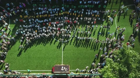 Aerial view of Children dancing in the school stadium Video stock 134385129
