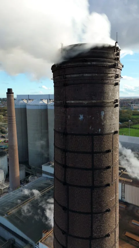 Aerial view of a chimney stack with smoke, United Kingdom. Stock Footage 321131864