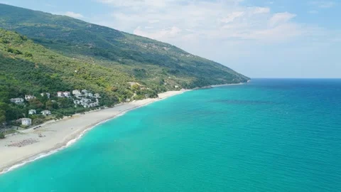 Aerial view of Chorefto Beach along the lush green slopes of Mount Pelion Stock Footage 346696495