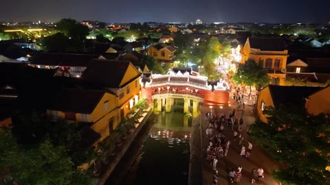 Aerial view of Chua Cau or Japanese Covered ancient Bridge in evening Video stock 308956317