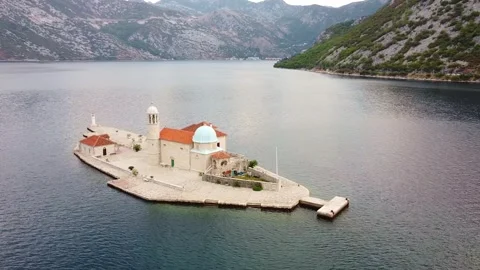 Aerial view of church complex on small island in Bay of Kotor Montenegro Stock-Footage 342773238