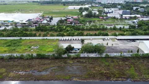 Aerial view of cigarette distribution warehouse in Banjarmasin Stock Footage 328711194