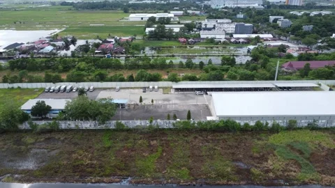Aerial view of cigarette distribution warehouse in Banjarmasin Stock Footage 328711254