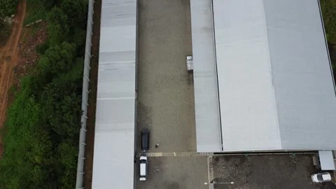 Aerial view of cigarette distribution warehouse in Banjarmasin Stock-Footage 328970511
