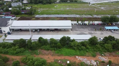 Aerial view of cigarette distribution warehouse in Banjarmasin Stock Footage 328970549