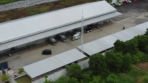 Aerial view of cigarette distribution warehouse in Banjarmasin Stock Footage 329401369
